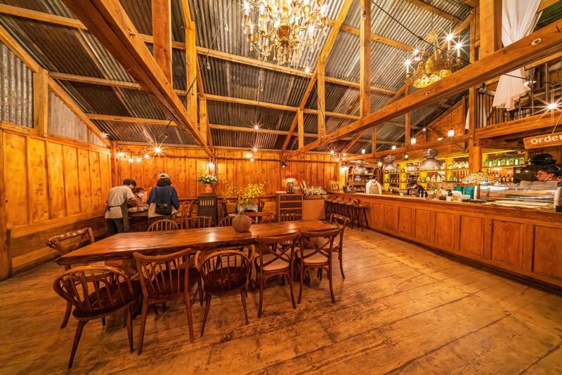 Tatte restaurant interior with warm lighting and artisan decor
